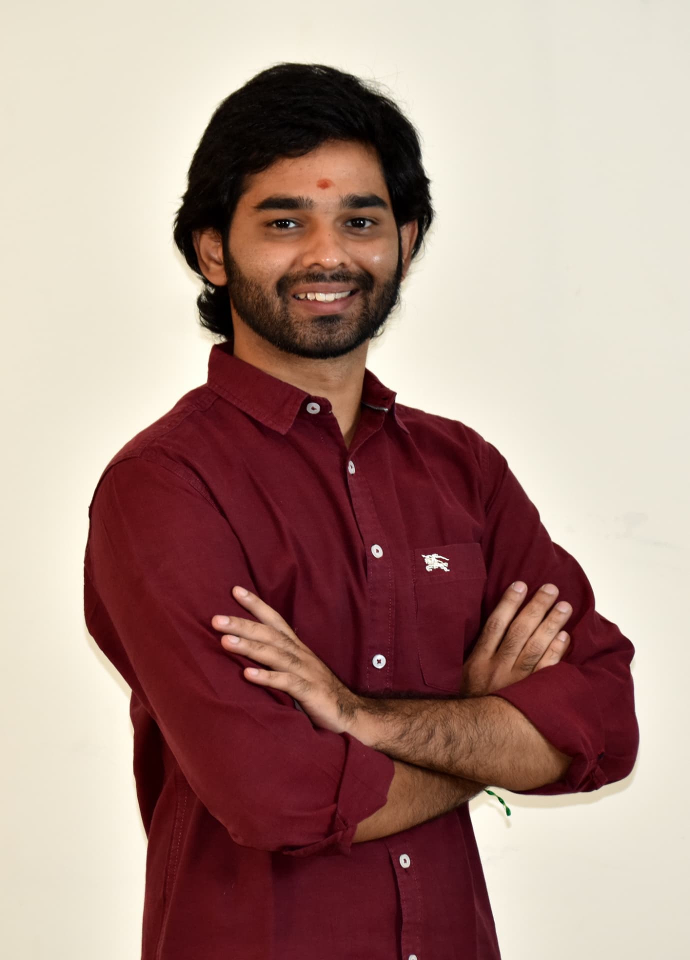 Portrait of TLN Swamy, Co Founder of Practice Growth Hub, in a maroon shirt.