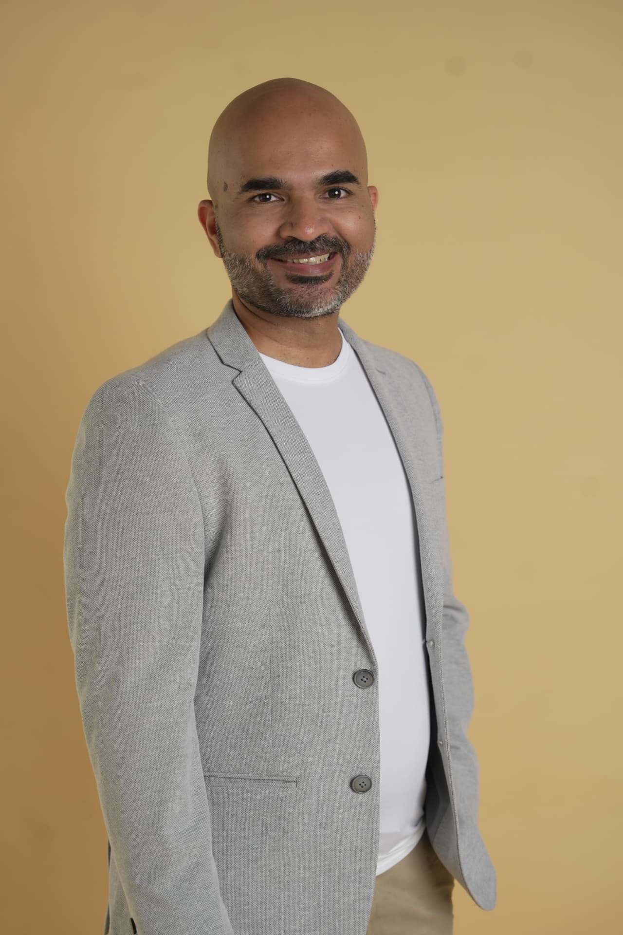 Portrait of Arvind Kumar T, Founder of Practice Growth Hub, in a light grey blazer.